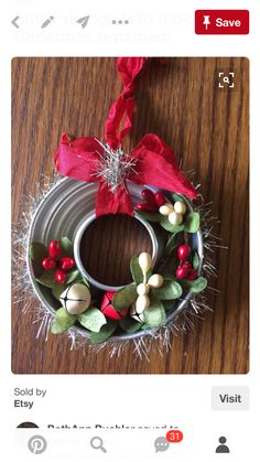 a tin can wreath on a wooden table