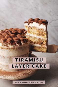 a close up of a cake on a plate with the words tiamisu layer cake