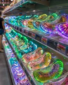 many different colored lights on display in a store