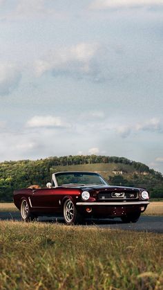 a classic car parked on the side of the road