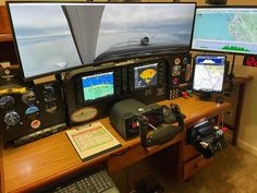 there are two monitors on the desk and one is turned on with an air plane in the background