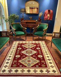 a living room filled with furniture and a red rug