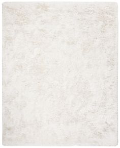 an area rug with white fur on the top and bottom, it is very soft