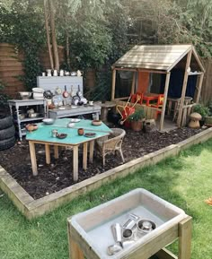 an outdoor kitchen is set up in the yard