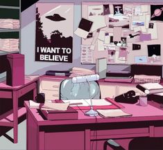 a desk with a computer monitor, keyboard and papers on it in front of a poster that says i want to believe