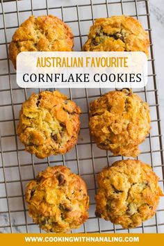 four cookies cooling on a wire rack with the words australian favorite cornflake cookies