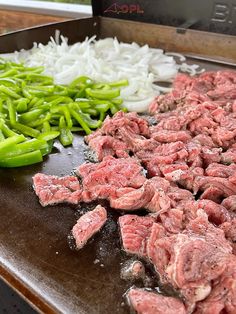 chopped meat and green beans on a grill