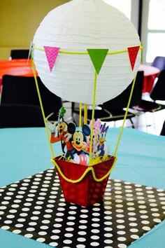 a mickey mouse hot air balloon on a table