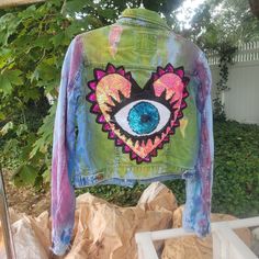 a jacket with an eye painted on it