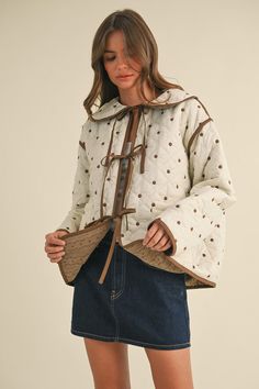 Fits TTS- the model is wearing a small. The Penny Polkadot Quilted Jacket is a brown and cream polkadot embroidered quilted jacket with reversible corduroy side. Contrast: 100% Cotton, Lining: 100% Polyester The Model, Quilted Jacket, Sales Gifts, Outerwear Jackets, Boutique Clothing, Jacket Dress, Penny, Sweater Top, Polka Dots