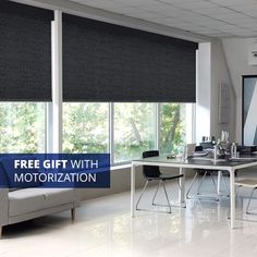 a living room filled with furniture and windows covered in roman blind shades that are black