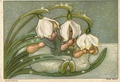 two babies are laying down next to each other with white flowers on their heads and green leaves