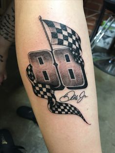 a tattoo with the number 80 on it and checkered flag in the shape of numbers