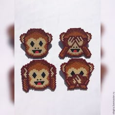 four pixelated monkey faces on a white background