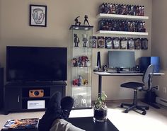 a living room filled with furniture and a flat screen tv