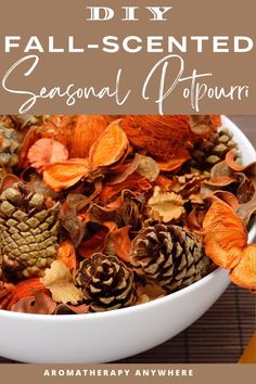 a white bowl filled with autumn leaves and pine cones