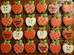 decorated cookies are arranged on a cooling rack