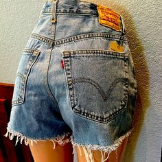 For Sale: High-Rise Vintage Levi's Jean Shorts, Perfect For Adding A Retro Touch To Your Wardrobe. These Iconic Shorts Feature A Flattering 12-Inch Rise, A Waist Measurement Of 16.5 Inches, Hips Measuring 22.5 Inches, And A 3-Inch Inseam. Size Can Be Subjective, So Please Refer To The Provided Measurements To Ensure The Best Fit. Perfect For Casual Summer Days Or Pairing With Your Favorite Vintage Tee! Loose Jean Shorts, Levi Jean Shorts, Levis Denim Shorts, Cutoff Jean Shorts, Baggy Shorts, High Rise Denim Shorts, Waist Measurement, Levi’s 501, Loose Jeans