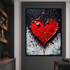 a red heart on a black and white background is displayed in a modern living room