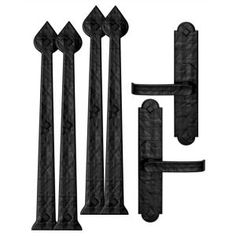 an assortment of black iron fence posts and gate post brackets with one pole missing the top