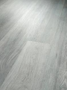 an image of wood flooring that looks like it has been painted in grey tones