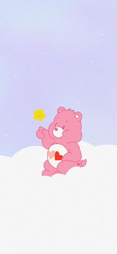 a pink teddy bear sitting on top of a snow covered hill next to a yellow bird