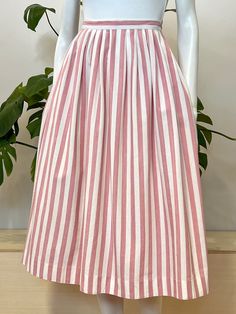 vintage pink & white striped cotton pleated midi length skirt w/ side pockets 'Eddie Bauer' made in Hong Kong 100% cotton tag size 12, fits modern small/medium 28 inch waist open hip measurement  32 inch length  covered back zipper & button at waistband  excellent condition, normal light wear Pink Pleated Cotton Skirt, Pink Pleated Knee-length Skirt, Vintage Pleated Pink Skirt, Pink A-line Pleated Maxi Skirt, Pink Midi-length Lined Skirt, Midi Length Skirts, Stripe Skirt, Eddie Bauer, Vintage Pink