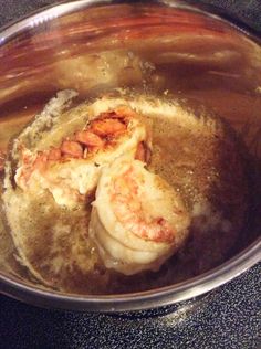 some food is cooking in a pan on the stove