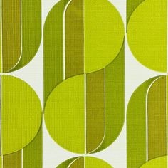 a green and white wallpaper with circles on it