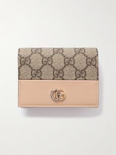 Gucci's wallet is made from durable textured-leather with a signature coated-canvas outer, so it will easily withstand constant use and survive knocks and scrapes in the bottom of your bag. Topped with a tonal logo plaque, it's fitted with five card slots and a zipped compartment to secure coins. Gucci Brown Wallets With Interior Card Slots, Brown Gucci Wallets With Interior Card Slots, Designer Beige Wallets With Interior Card Slots, Designer Beige Wallet With Interior Card Slots, Designer Textured Leather Wallets For Everyday, Gucci Beige Wallet, Beige Gucci Wallet For Everyday Use, Designer Beige Wallet For Daily Use, Luxury Beige Wallet For Daily Use