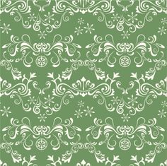 a green background with white swirls and flowers