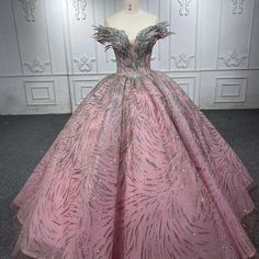 a pink ball gown with silver sequins on it