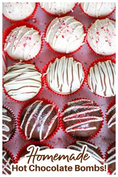 chocolates with white frosting and sprinkles are arranged on a red tray