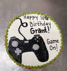 a birthday cake with a video game controller on it