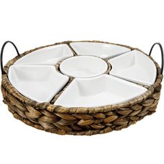 a wicker basket with four plates in it