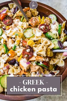 greek chicken pasta salad in a bowl with a serving spoon next to it and the title overlay reads, greek chicken pasta