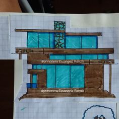 a piece of paper that has been cut out to look like a building with blue windows