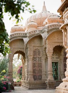 an intricately designed building with arches and pillars