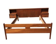 a wooden bed frame with drawers on each side