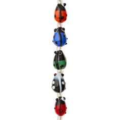 a multicolored glass bead with ladybugs on it's sides