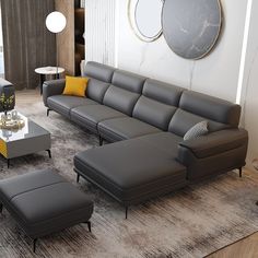 a modern living room with grey leather furniture and yellow accent pillows on the couches