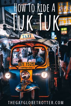 an orange and blue taxi cab with the words how to ride a tuk - tuk