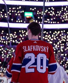 a hockey player is standing in front of the crowd