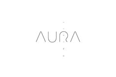 the word aura is written in cursive font on a white background with black dots