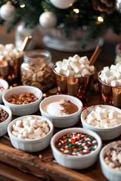 there are many different types of hot chocolates in bowls on the table next to each other