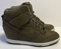 Nike Dunk Sky Hi Olive Suede Hidden Wedge Sneakers Womens Size 7 528899-200. Good preowned condition with light scuffing/marks on upper and minimal sole wear. Please email with questions prior to buying. All sales final. Thank you! Nike Basket, Nike Wedges, Hidden Wedge Sneakers, Wedge Trainers, Nike High Tops, Nike High, Baskets Nike, Nike Shoes Women, Wedge Sneakers