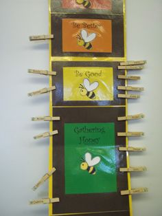 three bee bulletin boards with clothes pins attached to them