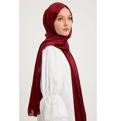 Shine Hijab Shawl - Burgundy Glossy in texture and elegant in appearance, our shine shawl is set to be the next great addition to your wardrobe! Its sleek shine makes for an impressive final touch to formal wear so you could look and feel your best on any special occasion. FEATURES: - Glossy finish - Suitable for all seasons - Opaque (not transparent) MATERIAL: - 75 cm x 185 cm - Polyester CARE: - Hand wash separately in cold water. - Lay flat to dry. - Iron on low without steam. Made in Turkey Elegant Wedding Hijab, Elegant Shawl For Eid And Formal Occasions, Elegant Shawl For Formal Eid Occasions, Formal Solid Color Satin Scarves, Elegant Formal Shawl For Eid, Elegant Scarves For Formal Festive Occasion, Elegant Red Scarf For Festive Season, Elegant Formal Scarf For Festive Occasions, Elegant Formal Scarves For Festive Occasions