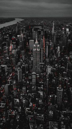 an aerial view of the city lights and skyscrapers in new york, ny at night