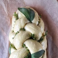 bread with sage leaves and herbs on top